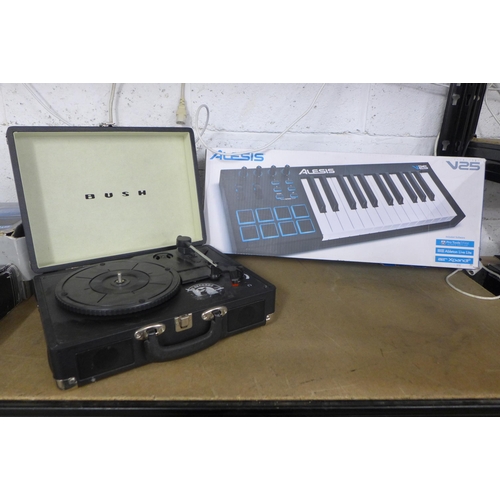 2136 - A Bush portable turntable record player and an Alesis keyboard