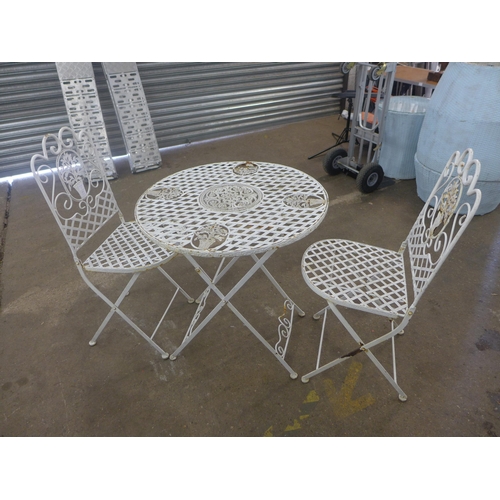 2245 - A white metal garden table and two chairs
