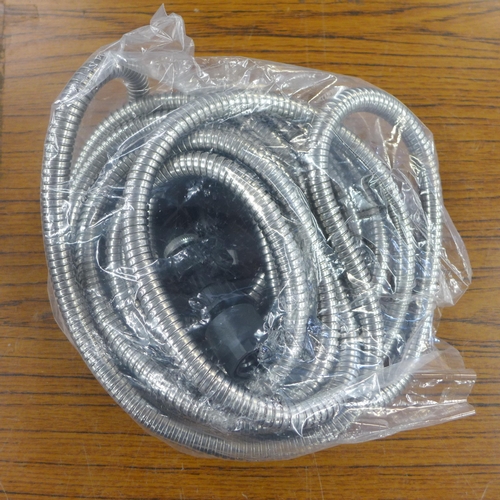 2267 - An Amazon multi-purpose waterproof poly tarp cover and a flex steel  25 ft hose, boxed