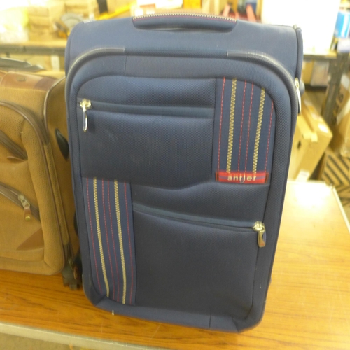 2363 - Two Kangol hand luggage suitcases, an Antler hand luggage suitcase and a Calpak luggage bag