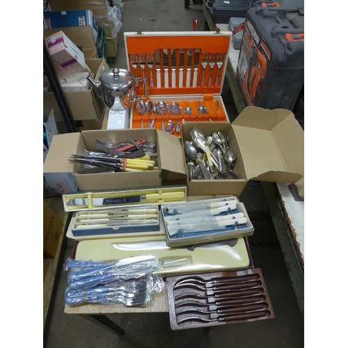 2390 - A large quantity of cutlery including mainly stainless steel and nickel plated knives, forks and spo... 