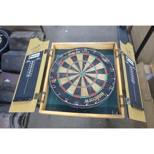 2417 - A dart board and cabinet