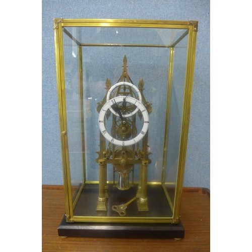 296 - A cased brass fusee skeleton clock