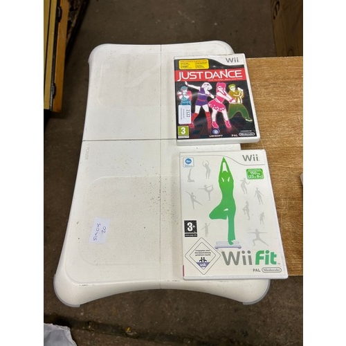 2122 - A Nintendo Wii with controller, joystick, Wii board, Just Dance and Wii Fit