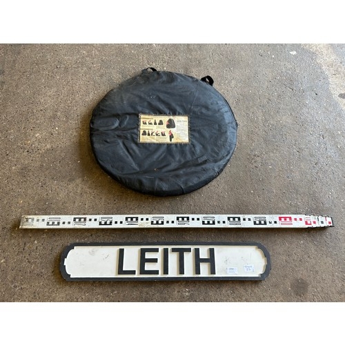 2354 - A tanning tent, a Leith station sign and a measuring stick