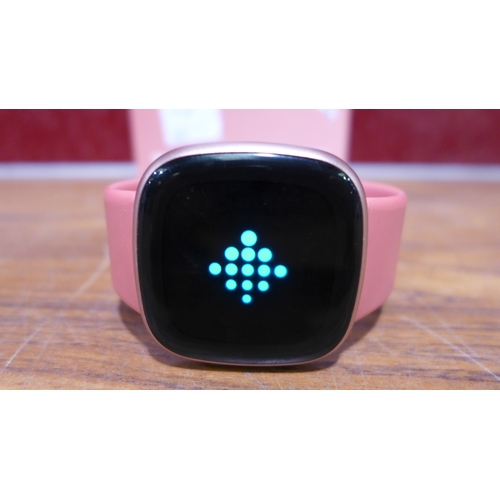 3153 - Fitbit Versa 4 Pink, original RRP £144.99 + VAT            (303-60) * This lot is subject to VAT