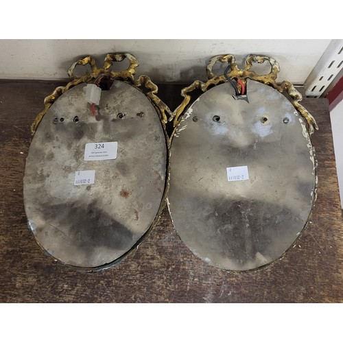 324 - A pair of French rococo style gilt metal and glass wall lights, 26cms h