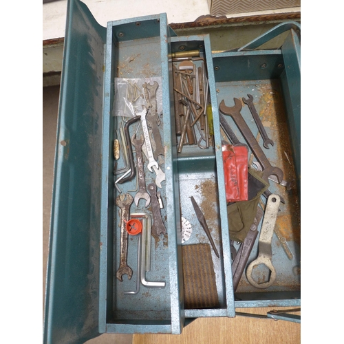 2034 - A metal tool box with assorted hand tools inc. spanners, pliers, screwdrivers, etc.