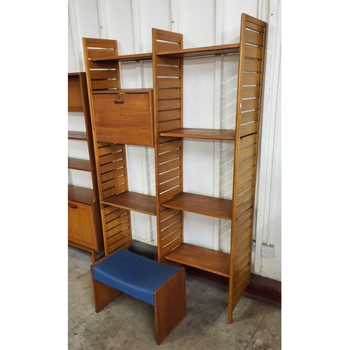 6 - A Staples teak Ladderax two bay room divider, with stool