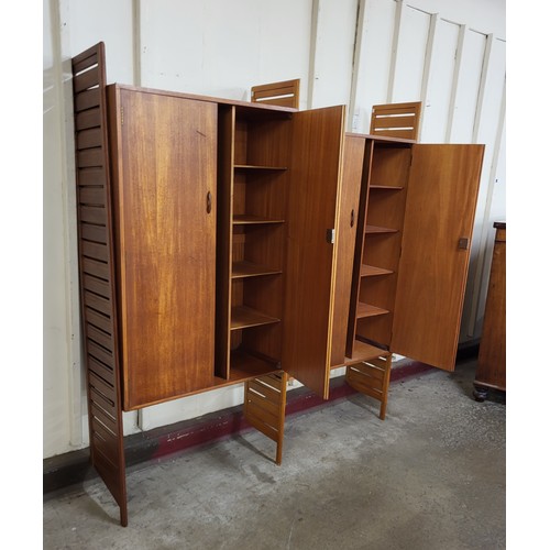 7 - A Staples teak Ladderax two bay wardrobe