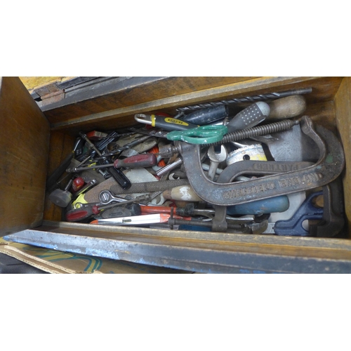 2056 - A blue wooden box with assorted tools including clamps, spanners, pliers, screwdrivers etc.