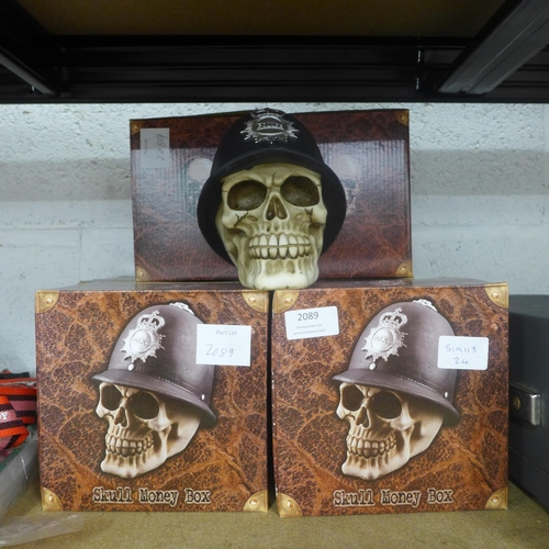 2089 - Six Police skull money boxes - new and boxed