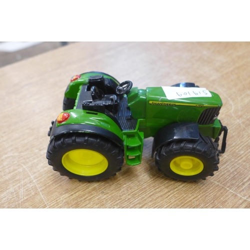 2118 - Two die-cast model John Deere tractors