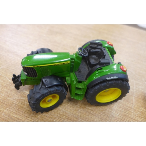 2118 - Two die-cast model John Deere tractors