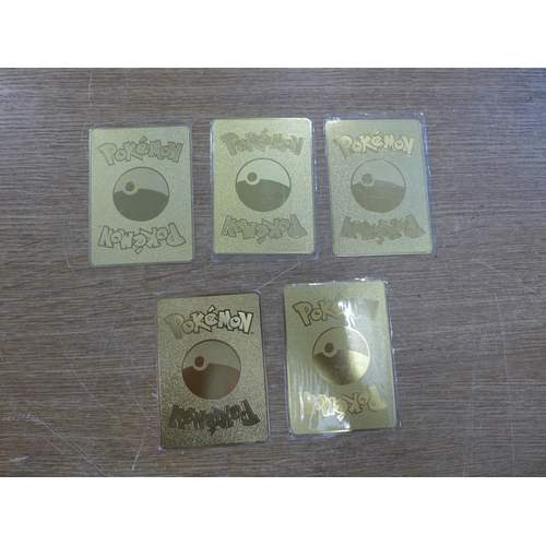 2125 - Five metal gold-coloured Pokemon cards