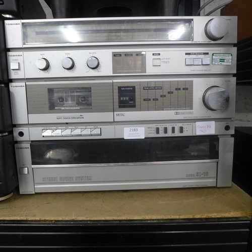 2183 - A Toshiba stereo sound system, inc:- stereo tuner, soft-touch cassette deck, front-sliding stereo tu... 