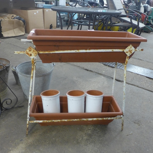 2253 - Plant stands with two troughs, plant pots and three metal buckets