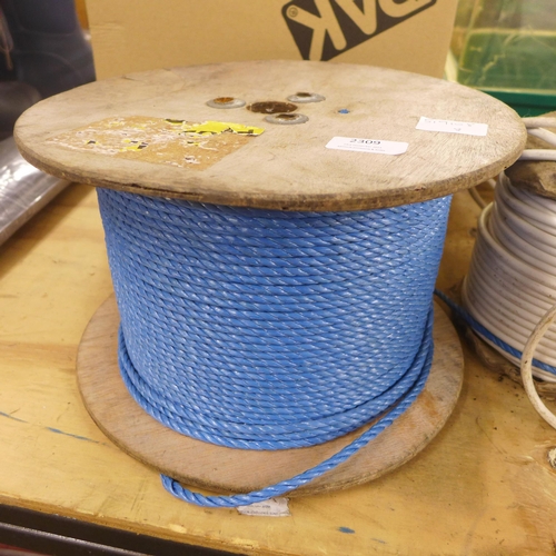 2309 - A reel of draw rope and two part reels of cable