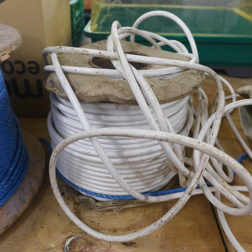 2309 - A reel of draw rope and two part reels of cable