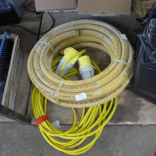 2436 - A 110v extension cable and a coil of compressor hose - 19 x 25 x 15mtrs - 20 bar/300PSi