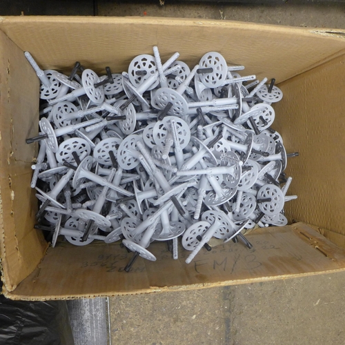 2437 - A large box of installation pegs