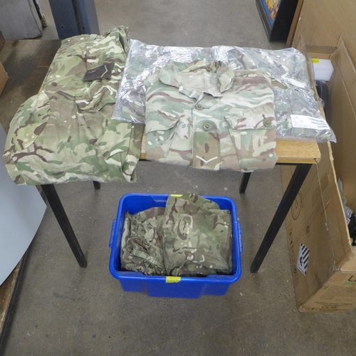 2447 - A bag of military/army clothing including trousers and shirts