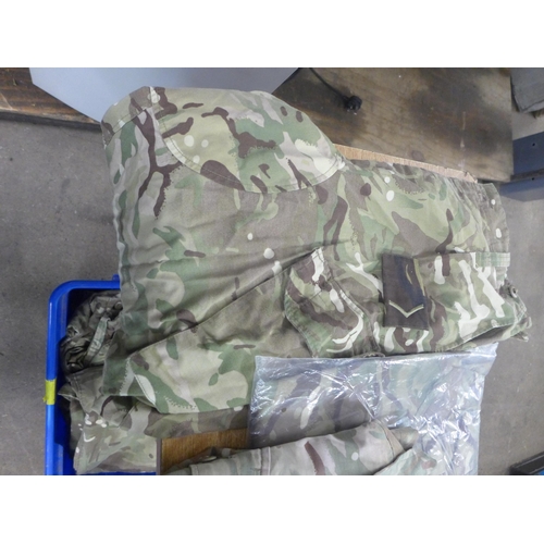 2447 - A bag of military/army clothing including trousers and shirts