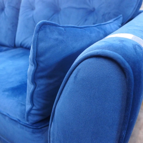 1347 - A Hoxton deep blue velvet upholstered three seater sofa RRP £799