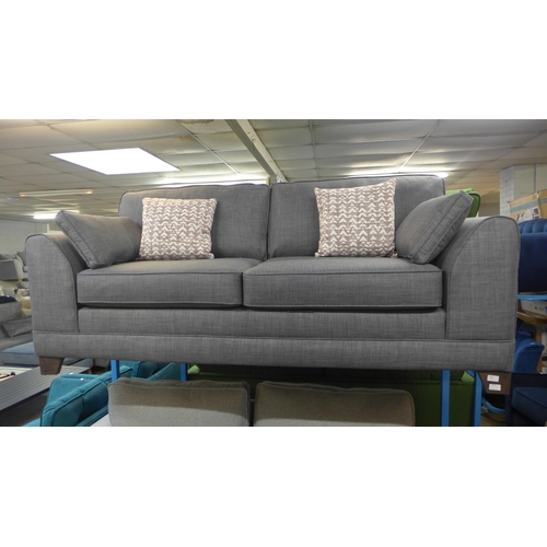 1474 - A grey upholstered three seater sofa with patterned scatter cushions and a footstool