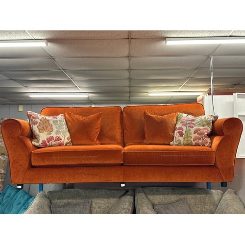 1309 - A tangerine velvet upholstered three seater sofa with Japanese Garden embroidered scatter cushions