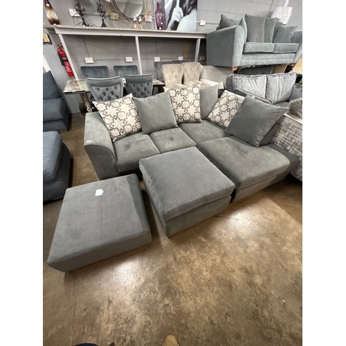 1486 - A mid grey upholstered right hand facing corner sofa with patterned scatter back cushions, footstool... 