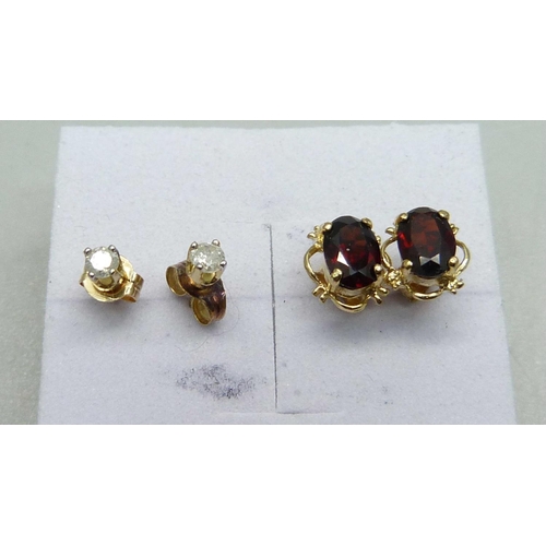 1051 - A pair of 9ct gold and diamond ear studs and a pair of 9ct gold and garnet earrings