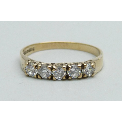 1057 - A 9ct gold, five stone zircon ring, 1.5g, Q