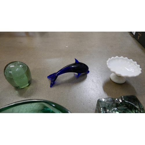 1064 - A Victorian green glass dump, large heavy green glass bowl, heavy glass ashtray, glass dolphin and w... 