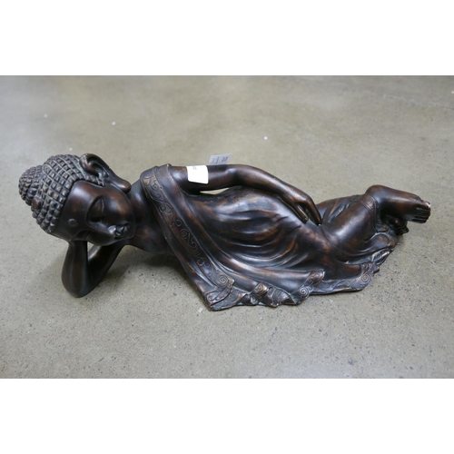 1072 - A Chinese resin figure of a reclining Buddha