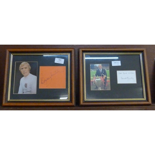 602 - Two framed and mounted photographs and signatures - Matt Busby and Bobby Moore