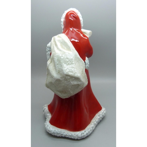 606 - A Royal Doulton Father Christmas figure, HN3399, (three small chips on the hood of the cloak)