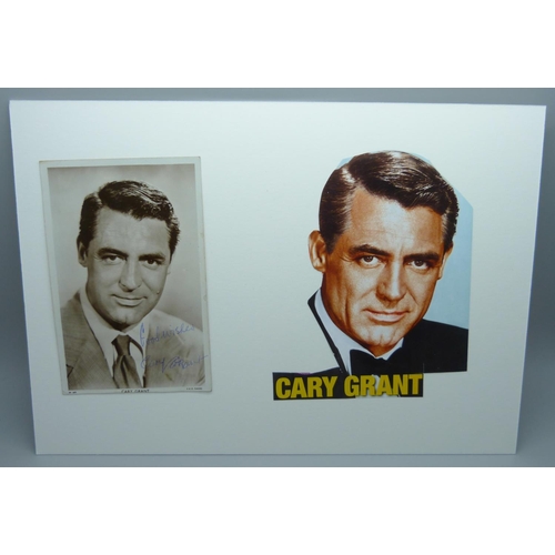 609 - A Cary Grant autographed card and cutting