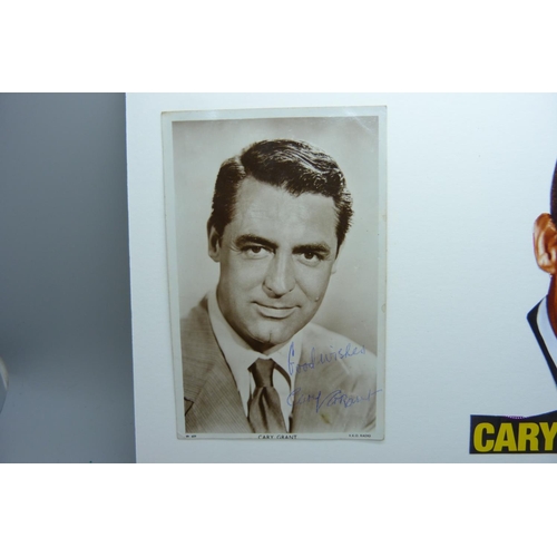 609 - A Cary Grant autographed card and cutting