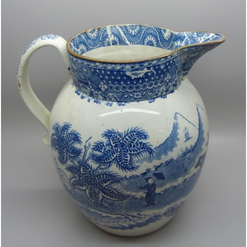 611 - A Georgian blue and white pearlware jug depicting a boy with oxen