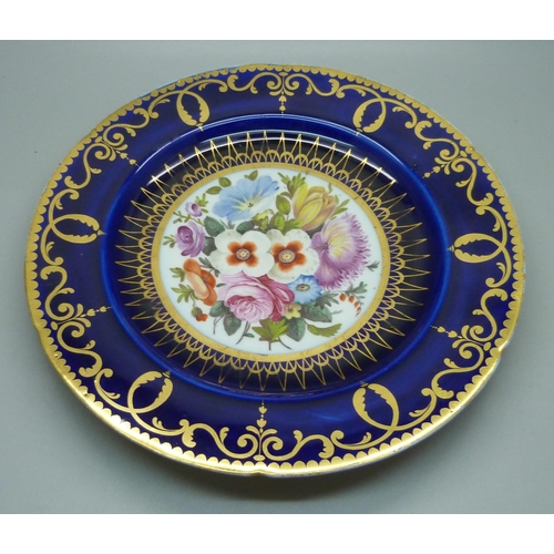 614 - A circa 1830 royal blue cabinet plate with hand painted floral decoration, (some scratches and wear ... 