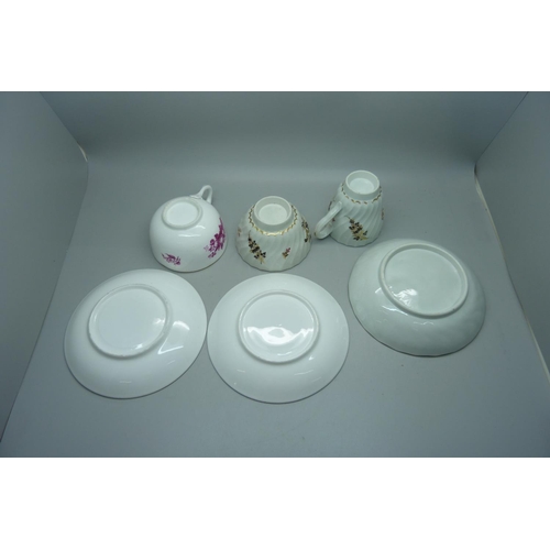 626 - A 19th Century fine porcelain cup and two saucers and a Georgian fine porcelain trio, painted and gi... 