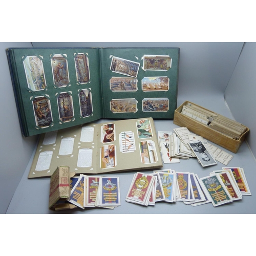 639 - A collection of military themed cigarette cards and others