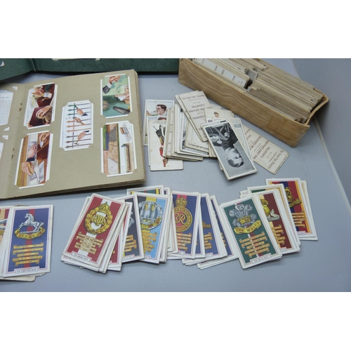 639 - A collection of military themed cigarette cards and others