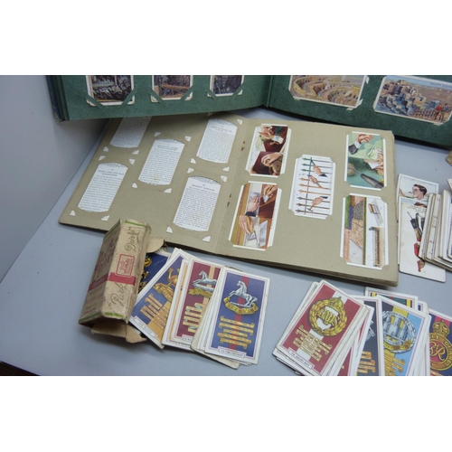 639 - A collection of military themed cigarette cards and others