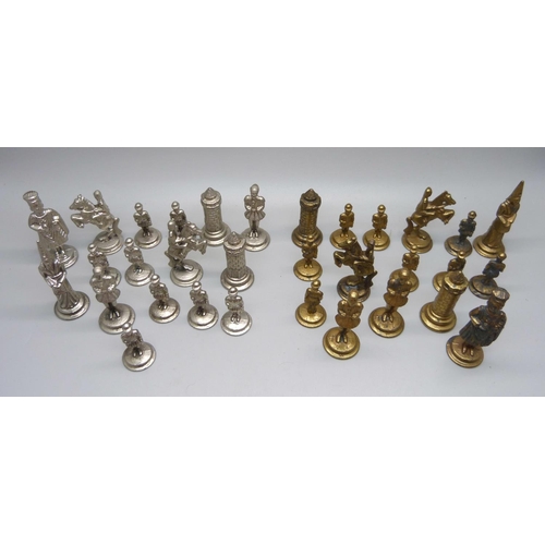 651 - A set of metal chess pieces