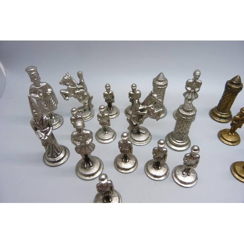 651 - A set of metal chess pieces