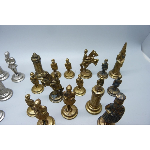 651 - A set of metal chess pieces