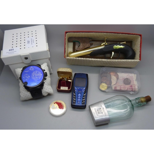 665 - A Diesel wristwatch, a/f, a novelty lighter, a Cognac flask, coins and two bank notes