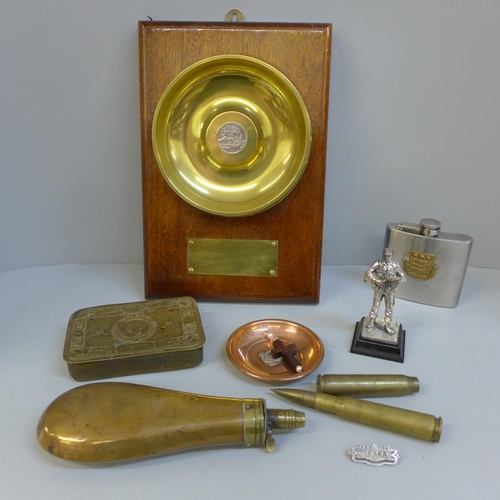 693 - Military items; a 1914 Christmas tin, a mounted shell case base, shot flask, etc.